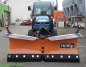 Preview: HILLTIP SnowStriker VTR Schneepflug in Orange an einem Klein-Traktor